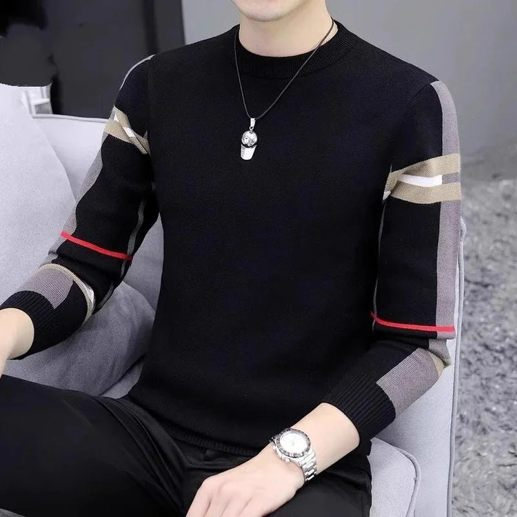 Black fitted knit sweater with color block striped sleeves and red accents, casual modern style.
