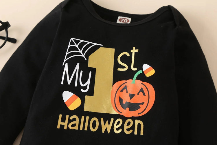 Black long sleeve baby shirt with Halloween print, gold text, pumpkin, and candy corn accents
