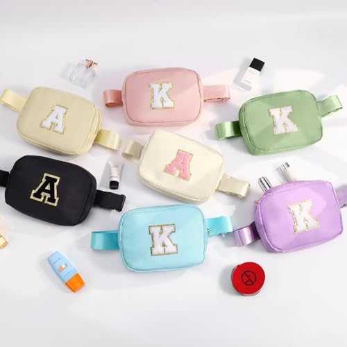 Assorted pastel and black canvas waist bags with bold letter patches, casual streetwear style