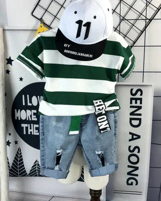 Kids streetwear outfit with green striped t-shirt, distressed denim shorts, and white cap