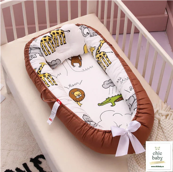 Plush baby nest with brown edge, white interior, cartoon animal print, placed in crib