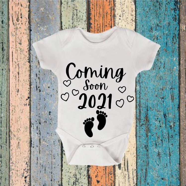White cotton baby onesie with black &
