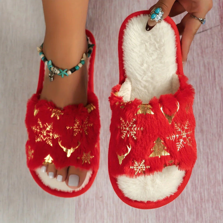 Red fuzzy open-toe slippers with gold holiday patterns and soft white lining