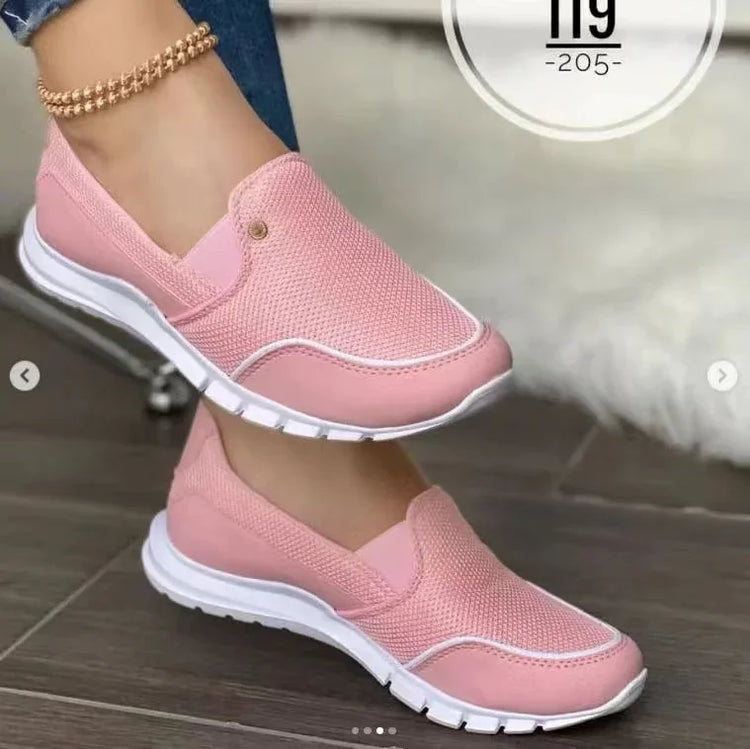 Pink slip-on mesh sneakers with white soles, casual fit, lightweight streetwear style