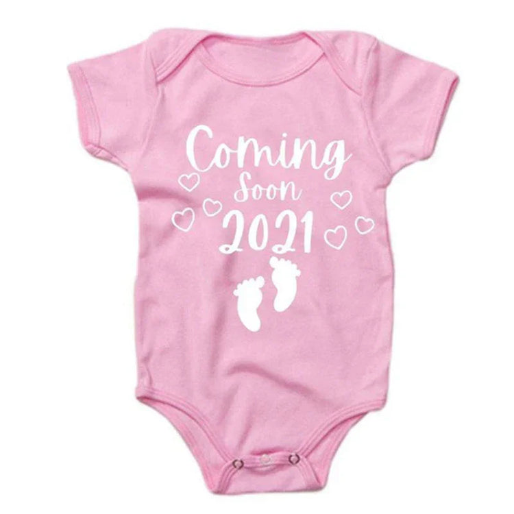 Pink short-sleeve cotton baby onesie with &