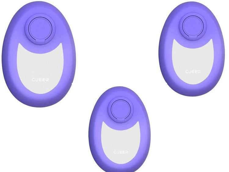 Three oval-shaped, purple and white tech accessories with a button on top, modern design