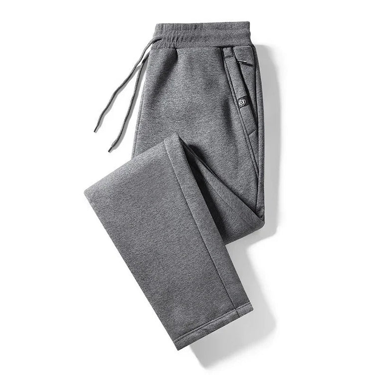 Grey fleece jogger pants with drawstring waist, relaxed fit, side pockets, soft material