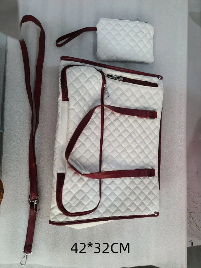 Quilted white and red travel bag set with adjustable straps and zippered pouches, 42x32 cm