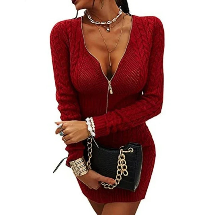 Woman wearing fitted red cable-knit sweater dress with zipper front and long sleeves