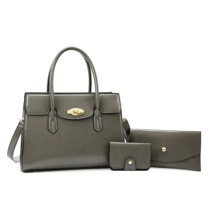 Gray leather handbag set with structured tote, wallet, and cardholder, gold hardware