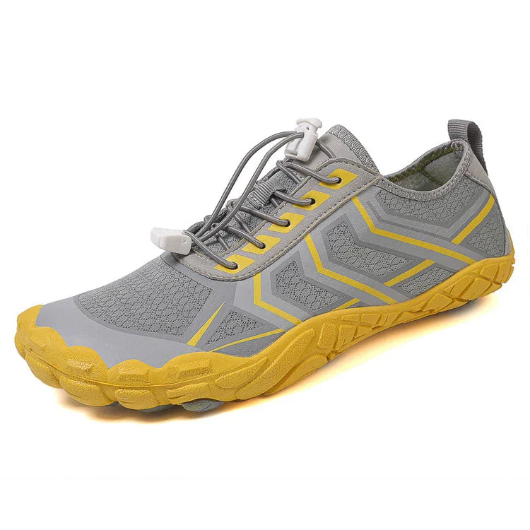 Lightweight grey and yellow athletic sneaker with mesh upper and easy-pull elastic laces
