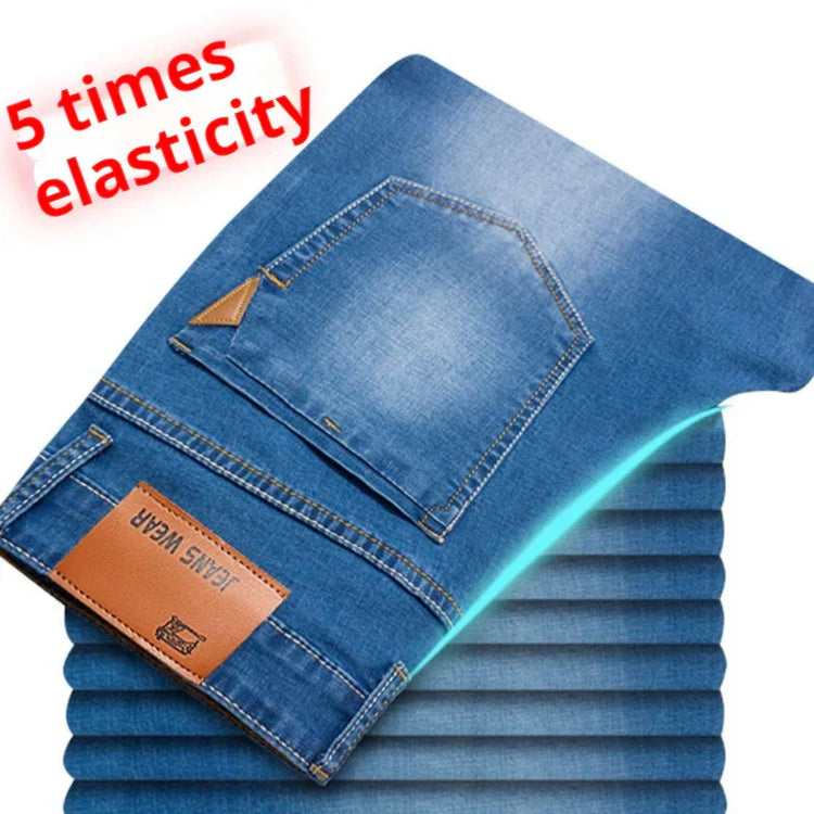 Blue stretch denim jeans with back pocket, fivefold elasticity, slim fit