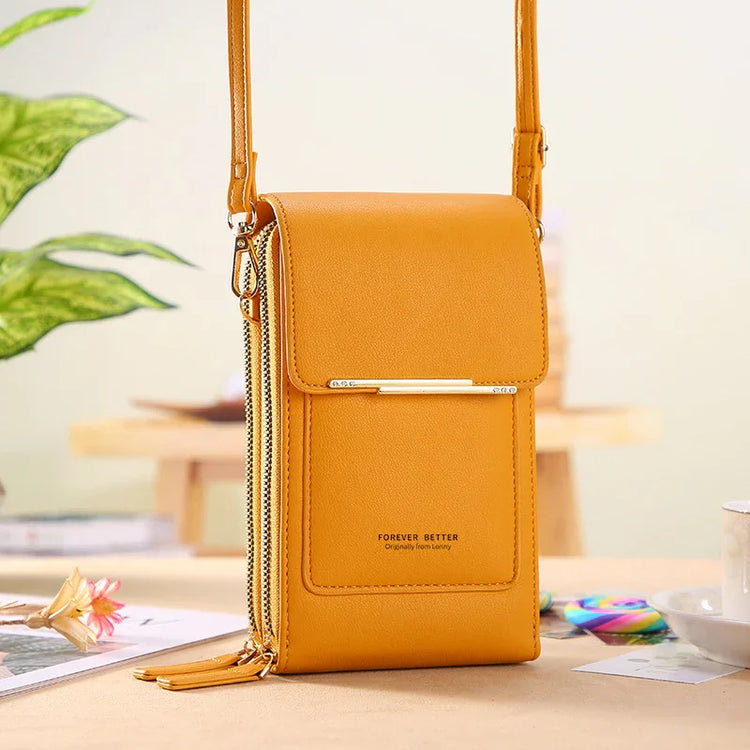 Yellow faux leather crossbody bag with zipper details and slim modern fit