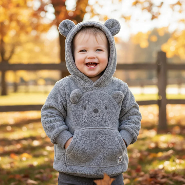 Toddler in gray fleece bear hoodie with ears, relaxed fit, outdoors in autumn