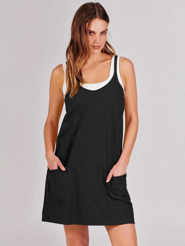 Sleeveless black cotton mini dress with scoop neck and front pocket detail, relaxed fit