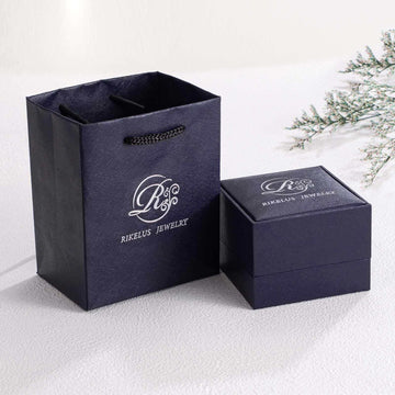 Navy textured gift bag and jewelry box set with white logo, elegant and minimal packaging