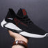 Black mesh athletic sneaker with red accents, white sole, modern streetwear style, lightweight fit
