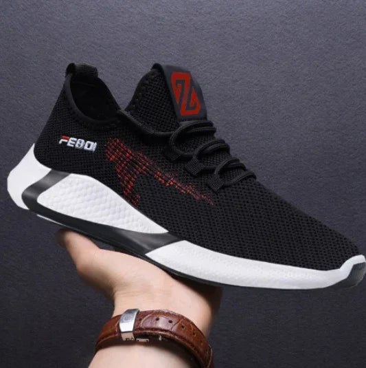 Black mesh athletic sneaker with red accents, white sole, modern streetwear style, lightweight fit