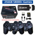 Black wireless gaming console with two controllers, USB stick, SD card, and charging cable.