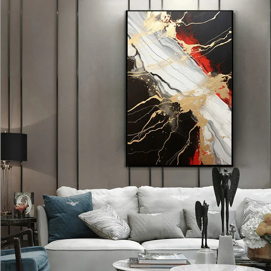 Modern living room with a grey sofa, abstract marble wall art in black, gold, white, and red tones