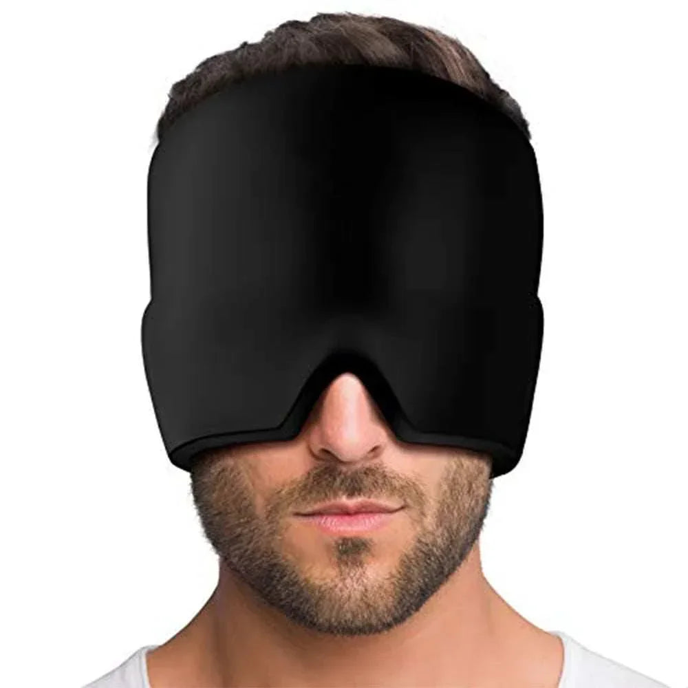 Man wearing oversized black padded eye mask with smooth finish, futuristic streetwear accessory