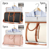 Travel duffel bags in black, white, and pink with tan straps and garment storage feature.