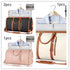 Travel duffel bags in black, white, and pink with tan straps and garment storage feature.