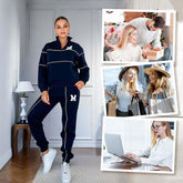 Woman wearing navy blue tracksuit with white piping and &