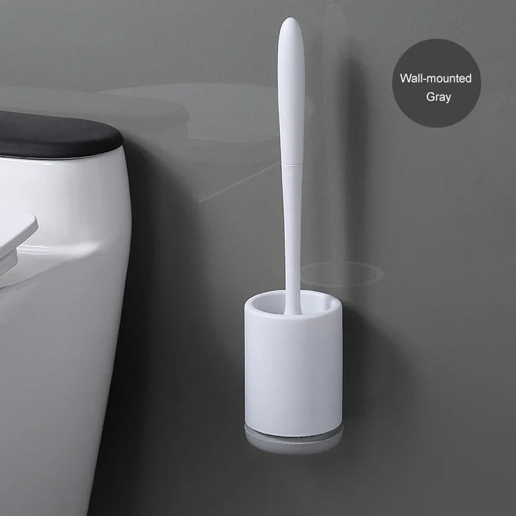 Minimalist wall-mounted gray toilet brush with sleek white holder next to toilet