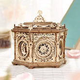 Intricately carved light wood mechanical music box with ornate, vintage-style design and laser-cut details