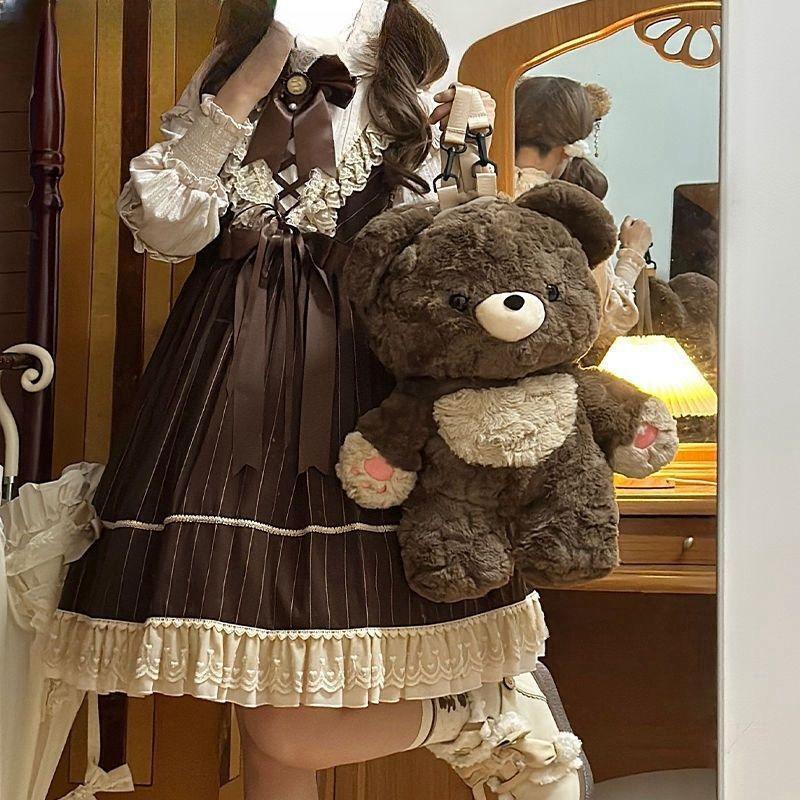 Brown and cream lace-trimmed lolita dress with puff sleeves and large teddy bear bag