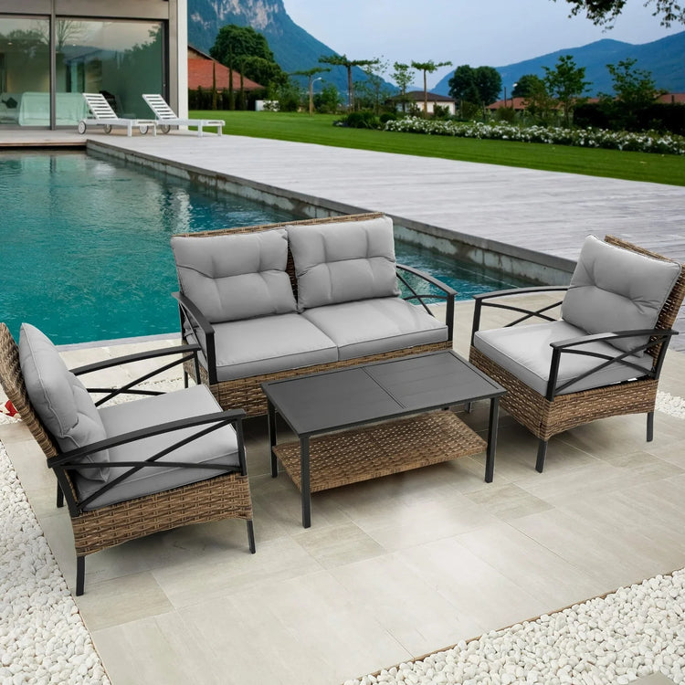 Modern outdoor patio set with gray cushions, rattan frame, and black metal arms by a pool.