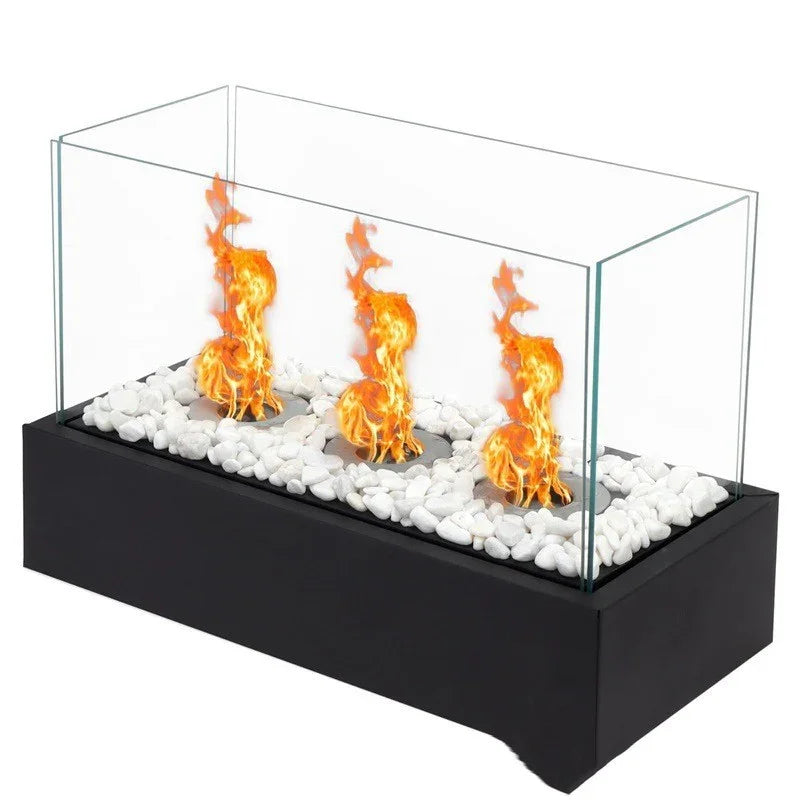 Modern tabletop fire pit with glass enclosure, white decorative stones, black base