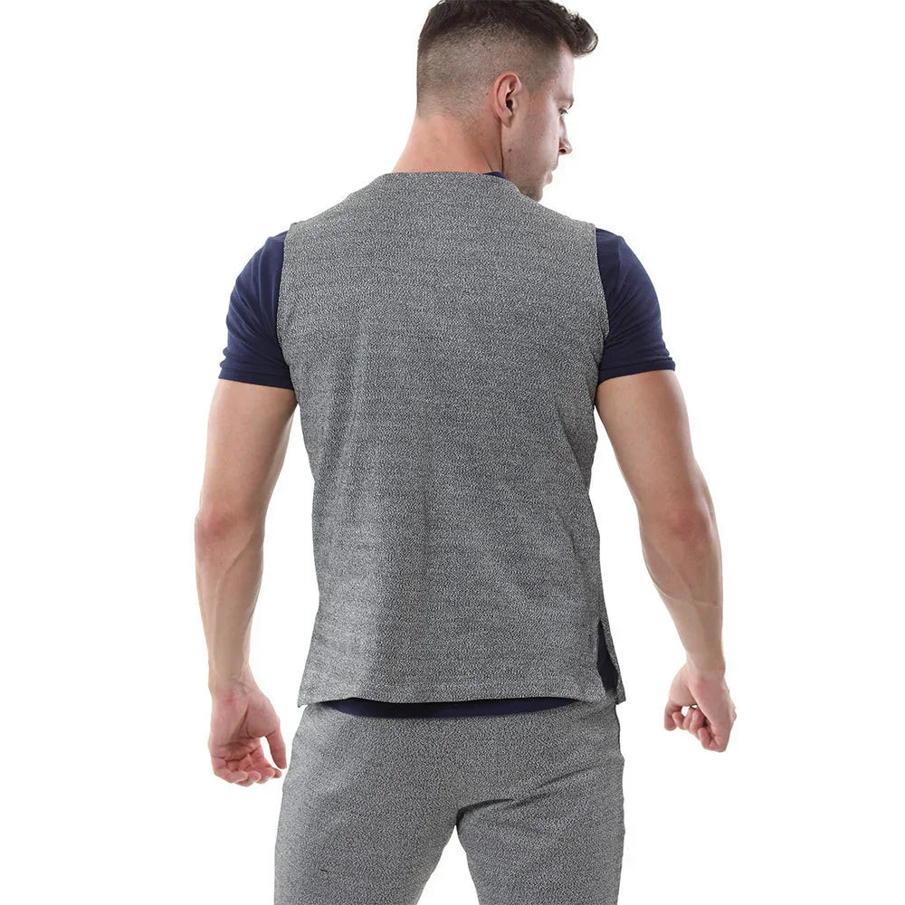 Man wearing slim fit grey textured sleeveless vest and matching joggers, viewed from back