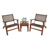 Two brown woven wooden armchairs with matching side table, coffee cups, and flower vase.