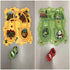 Two colorful play mats with track designs, animal illustrations, and toy cars on each mat.
