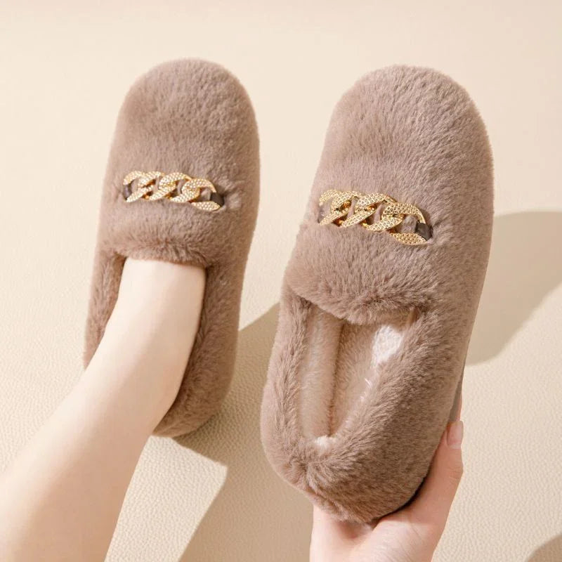 Brown plush slippers with gold chain detail, cozy fuzzy material, slip-on style