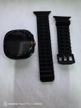 Black silicone watch band and case, modern design, shown unassembled on white background