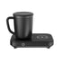Matte black ceramic mug with lid on a sleek electric mug warmer and wireless charger