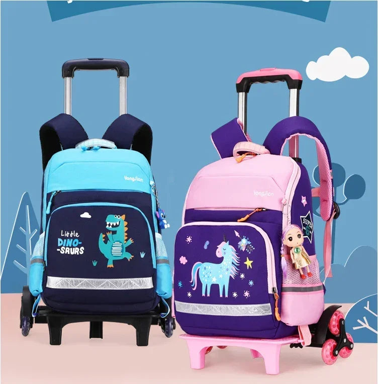 Children's rolling backpacks, one blue with dinosaur print and one pink with unicorn design, featuring cartoon graphics and adjustable straps.