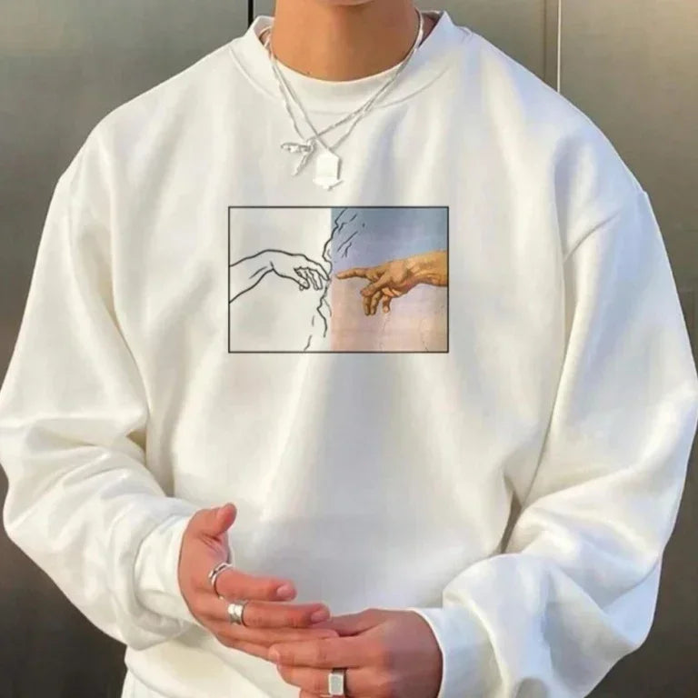 White oversized sweatshirt with artistic hand graphic, casual streetwear style, cotton fabric.