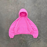 Oversized pink hoodie with front pocket, soft fleece material, relaxed fit, streetwear style