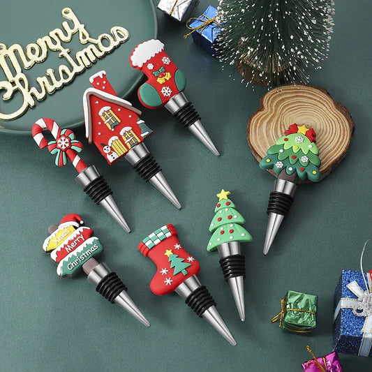 Set of festive Christmas silicone wine bottle stoppers in various holiday shapes on green background