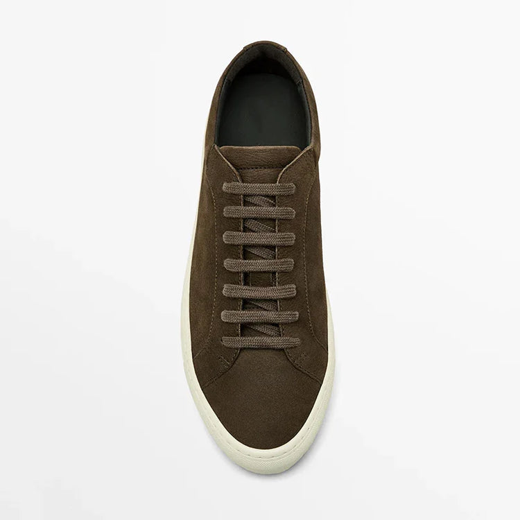 Brown suede low-top sneaker with flat laces and white rubber sole, casual streetwear style