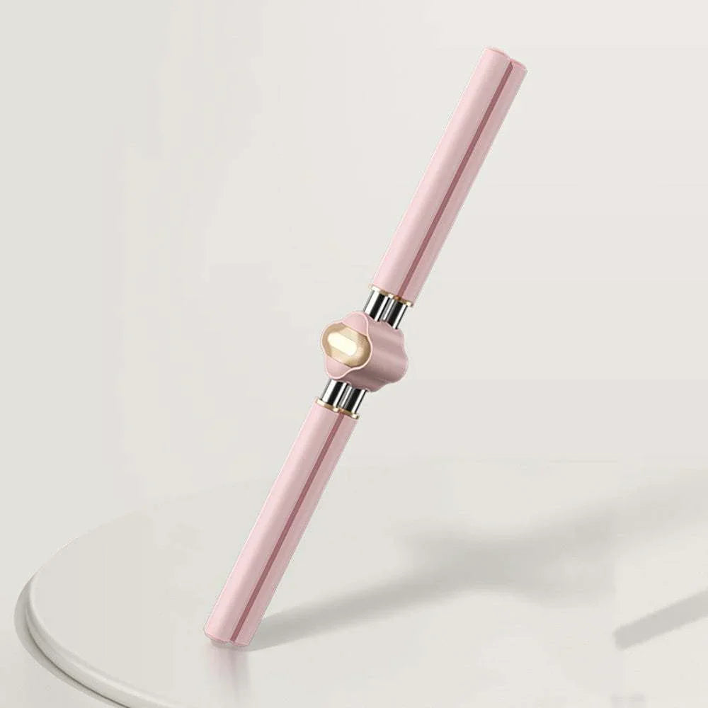 Pink and gold metallic facial roller massage tool with sleek, modern design on white surface