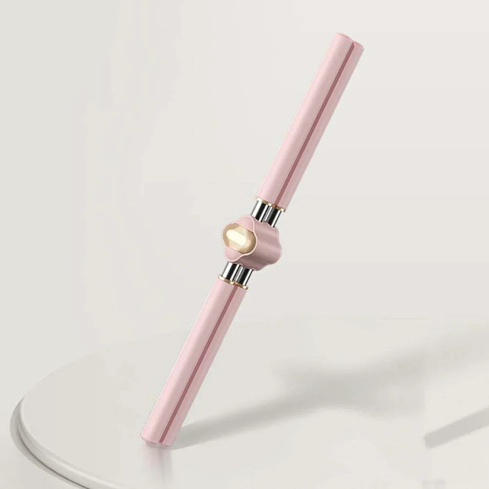 Pink and gold metallic facial roller massage tool with sleek, modern design on white surface