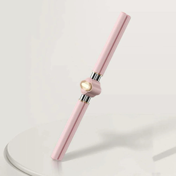 Pink and gold metallic facial roller massage tool with sleek, modern design on white surface
