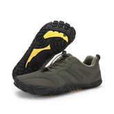 Olive green athletic sneakers with black and yellow rubber sole, lace-up design, low-top fit.
