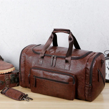 Brown faux leather duffle bag with multiple zip pockets, large size, structured fit
