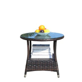 Round wicker side table with glass top, books on lower shelf, and a bowl of fruit on top
